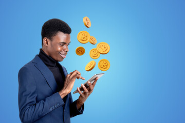 African American businessman holding smartphone with cryptocurre