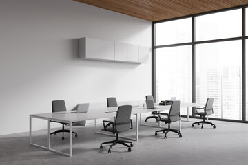 Light business room interior with chairs and shared table, panoramic window