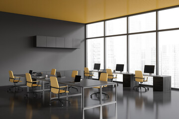 Corner view on dark office room interior with computers