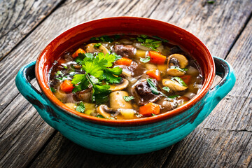 Mushroom soup on wooden table
