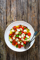 Caprese salad on wooden board
