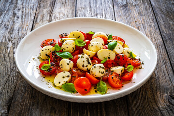 Caprese salad on wooden board
