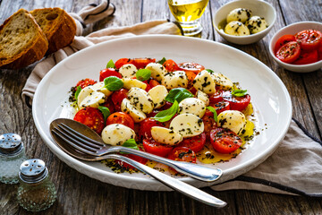 Caprese salad on wooden board

