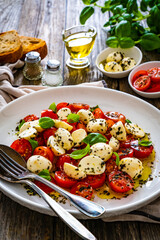 Caprese salad on wooden board
