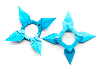 blue paper star on a white background. origami. papercraft. needlework