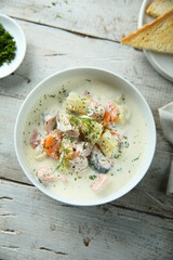Traditional fish soup with vegetables and cream