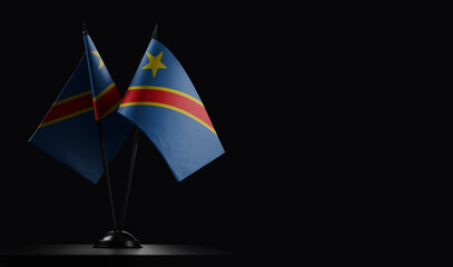 Small national flags of the Democratic Republic of the Congo on a black background