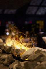 artificial fire in the fireplace, close up picture. - obrazy, fototapety, plakaty