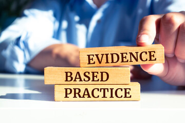 Close up on businessman holding a wooden block with 