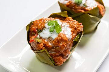 Steamed fish, shrimps or squid with curry paste mixed coconut milk (Hor Mok) ; Thai traditional spicy food.