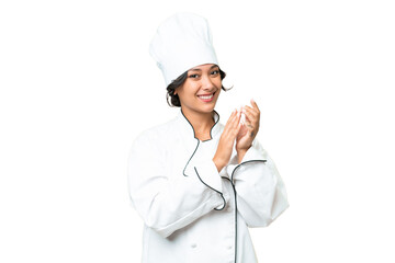 Young chef Argentinian woman over isolated background applauding after presentation in a conference