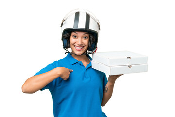 Pizza delivery Argentinian woman with work uniform picking up pizza boxes over isolated background with surprise facial expression