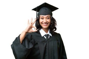 Young university graduate Argentinian woman over isolated background showing ok sign with fingers