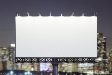 Blank white horizontal billboard on skyline background at evening, front view. Mock up, advertising concept