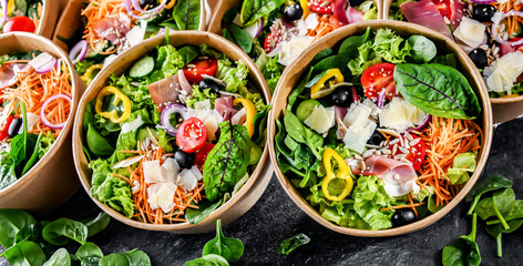 Paper boxes with pre-packaged vegetable salads ready for sale