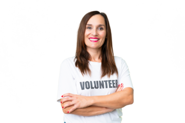 Middle age volunteer woman over isolated chroma key background keeping the arms crossed in frontal position