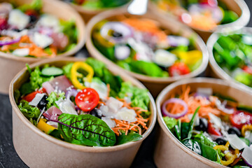 Paper boxes with pre-packaged vegetable salads ready for sale