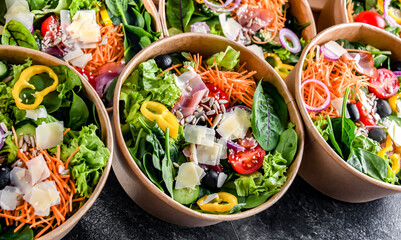 Paper boxes with pre-packaged vegetable salads ready for sale