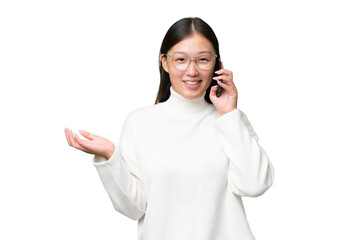 Young Asian woman over isolated background counting nine with fingers