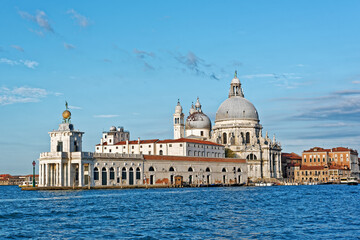 Fototapeta na wymiar Church Santa Maria della Salute and Punta della Dogana on Grand canal in Venice, built as a thanks or offering to the Virgin Mary against he plague in 1630