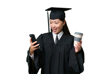 Young university graduate Asian woman over isolated background holding coffee to take away and a mobile