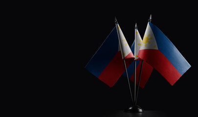 Small national flags of the Philippines on a black background
