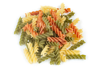 Raw colored pasta fusilli on a white isolated background.