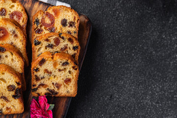 fruit cake sweet dessert dried fruit traditional pastry, nuts meal food snack on the table copy space food background rustic top view