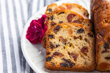 fruit cake sweet dessert dried fruit traditional pastry, nuts meal food snack on the table copy space food background rustic top view