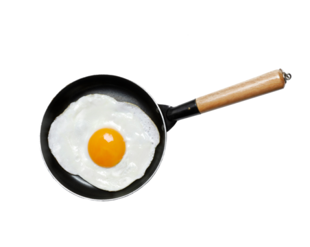 Fried egg yolk on frying pan isolated on transparent layered background.