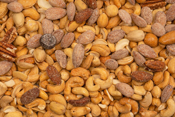 A group of almonds, pistachios, walnuts, macadamia, cashews.