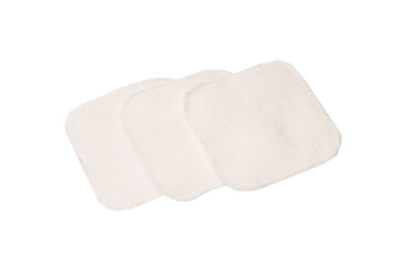 Stack of white cotton sponges isolated on a white background.