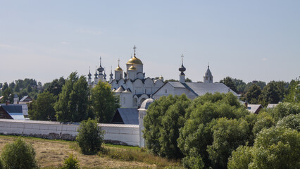 The ancient white-stone Pokrovsky convent in the historical place of Suzdal, Vladimir region, on a...