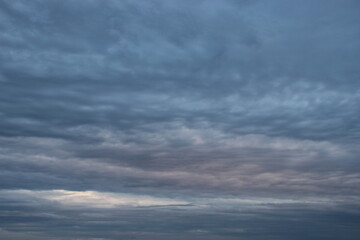 Naklejka na ściany i meble dark blue cloud with white light sky background and city light midnight evening time 