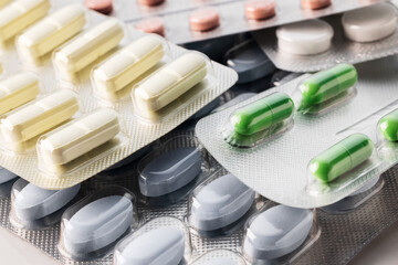 Heap of blister packs with colorful pills