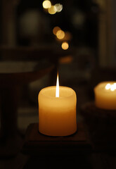 wax candle with burning flame indoors