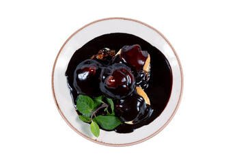 Delicious profiteroles with chocolate, top view
