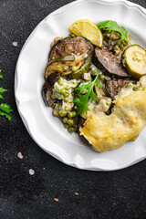 vegetable casserole eggplant, zucchini, green peas, cheese, bechamel sauce vegetables lasagne meal food snack on the table copy space food background rustic top view