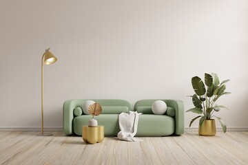 Green sofa with table on white wall and wooden flooring.