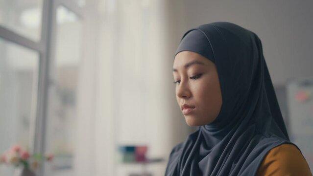 Closeup of upset young woman in hijab, difficulties that muslim women face