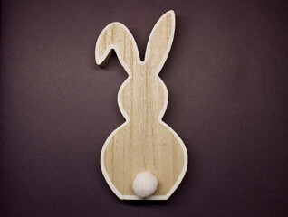 Wooden rabbit on ultimate purple color of the year 2022. Top view, flat lay background. Copies space.