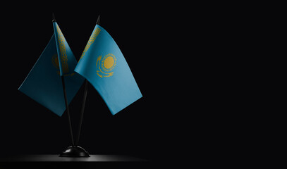 Small national flags of the Kazakhstan on a black background