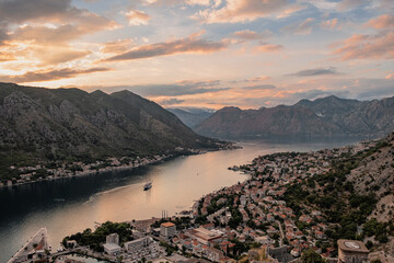 Amazing panoramic aerial view at sunset of Kotor bay from Kotor city walls and fortress, soft warm edit, Montenegro 