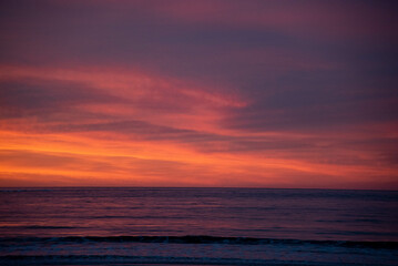 Fototapeta na wymiar Dramatic Colorful Contrast Sunrise on Beach
