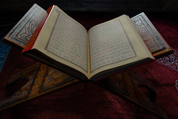 Islamic background photo. The Holy Quran or Kuran-i Kerim on the lectern.