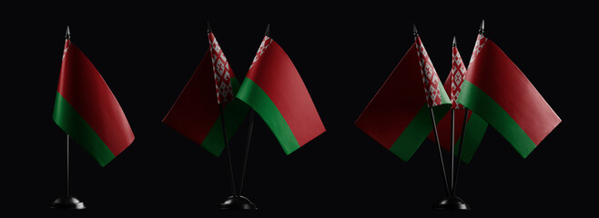 Small national flags of the Belarus on a black background