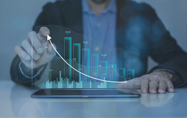 Businessman calculating ROI with tablet. Return of investment, increase of value, dividend concept.