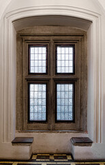Ancient gothic window  with stone frame and windowsill