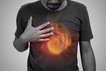 A man burning sensation in the of the middle chest because of acid reflux. Hot in middle chest...