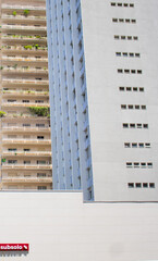 Two Buildings and a Sign with "undergorund level" written on it (Subsolo) 